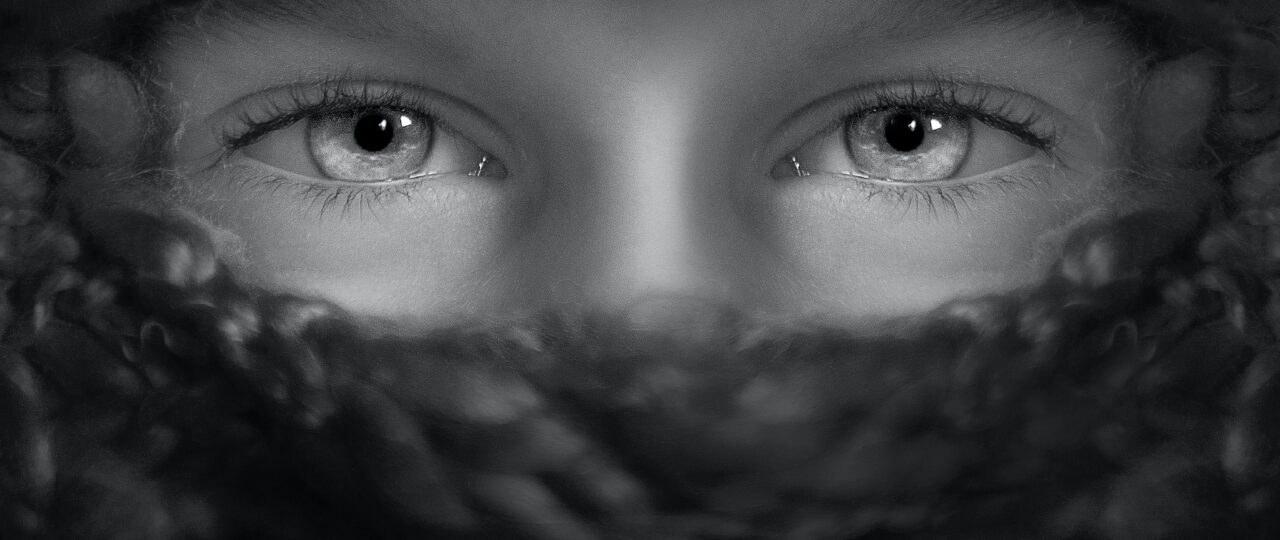 grayscale shot of person's eyes